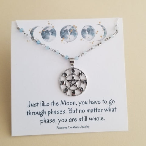 Beaded Aquamarine Necklace with Silver Moon Phases Pendant on a meaningful gift card.