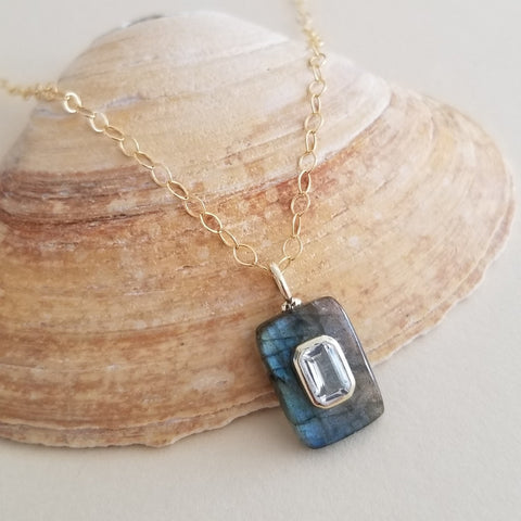 Dainty Labradorite pendant necklace featuring a shimmering Labradorite gemstone accented with an inlaid White Topaz stone, hanging from a delicate gold chain. Elegant and meaningful, this handmade necklace symbolizes clarity, intuition, and light,a perfect gift for her.