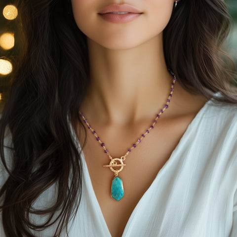 Handmade beaded amethyst necklace featuring a turquoise pendant and front toggle clasp, handcrafted boho chic jewelry with a touch of charm and elegance.