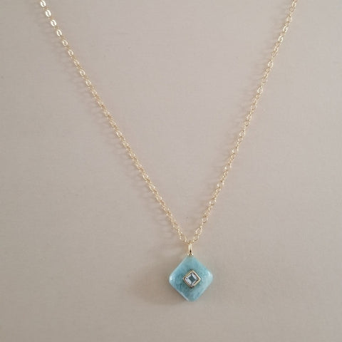 Delicate aquamarine pendant with white topaz inlay on a thin gold chain, dainty March birthstone necklace for women.