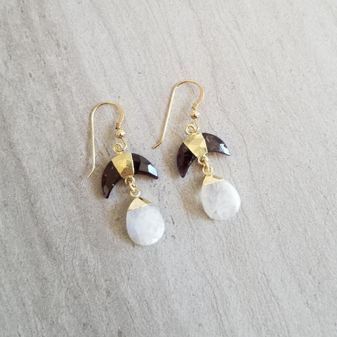 Gold garnet crescent moon earrings with glowing moonstone teardrops