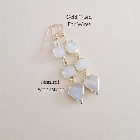 Gold filled ear wires dangle earrings with natural moonstone stones, shown on a light beige background with text overlays.