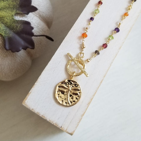 beaded gemstone necklace with dragonfly charm
